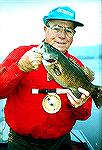 Here''s Lefty Kreh with a nice smallmouth bass.Lefty With SmallmouthJoe Reynolds