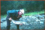 Gordon Kinder and his chum salmon that was caught in Oct., 2000 from the Fraser River. Kinder used an "After Dinner Mint" fly pattern, but a rolled 
muddler also proved highly effective for these bru