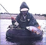 Joe Reymolds with a Mexican Hay (AZ) a fat rainbow trout. Mexican Hay RainbowTM