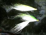 this fly was crafted to imitate a BROKEN BACK bait fish, I did it in green but think it would look better in blue/white as you can see the regular fly is on top an the BROKEN BACK is on the bottom.
G