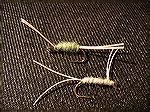 Couch Potato Category: Nymph  
Instructions: Start with a #8 Mustad wet nymph hook. Its a nymph I tyed useing synthetic material from my couch. Used as dubbing for the body. It's yellowish white and 